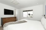 Primary bedroom: King bed and a TV